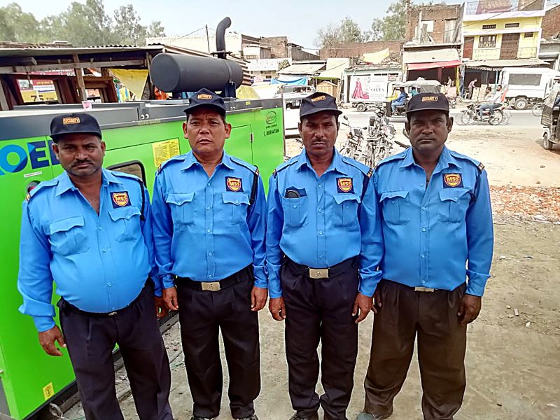 Modern Security Services guards in branded uniform at a commercial site
