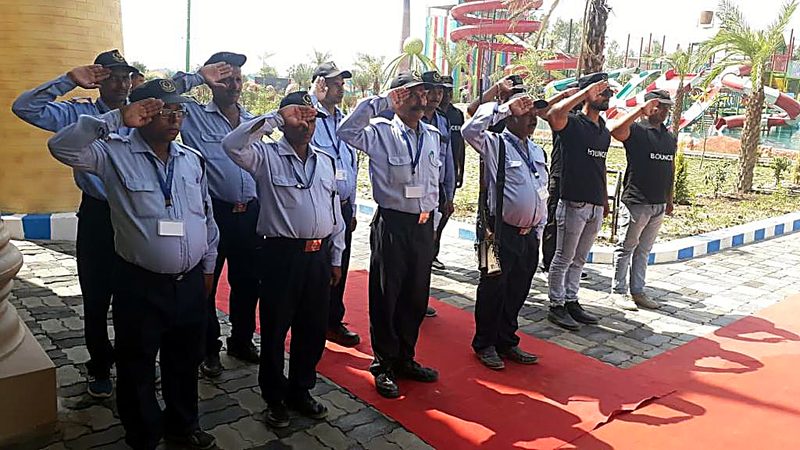 Modern Security Services guards and bouncers saluting at an event venue
